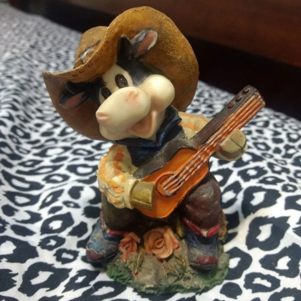 Small vintage cowboy figurine with guitar or banjo